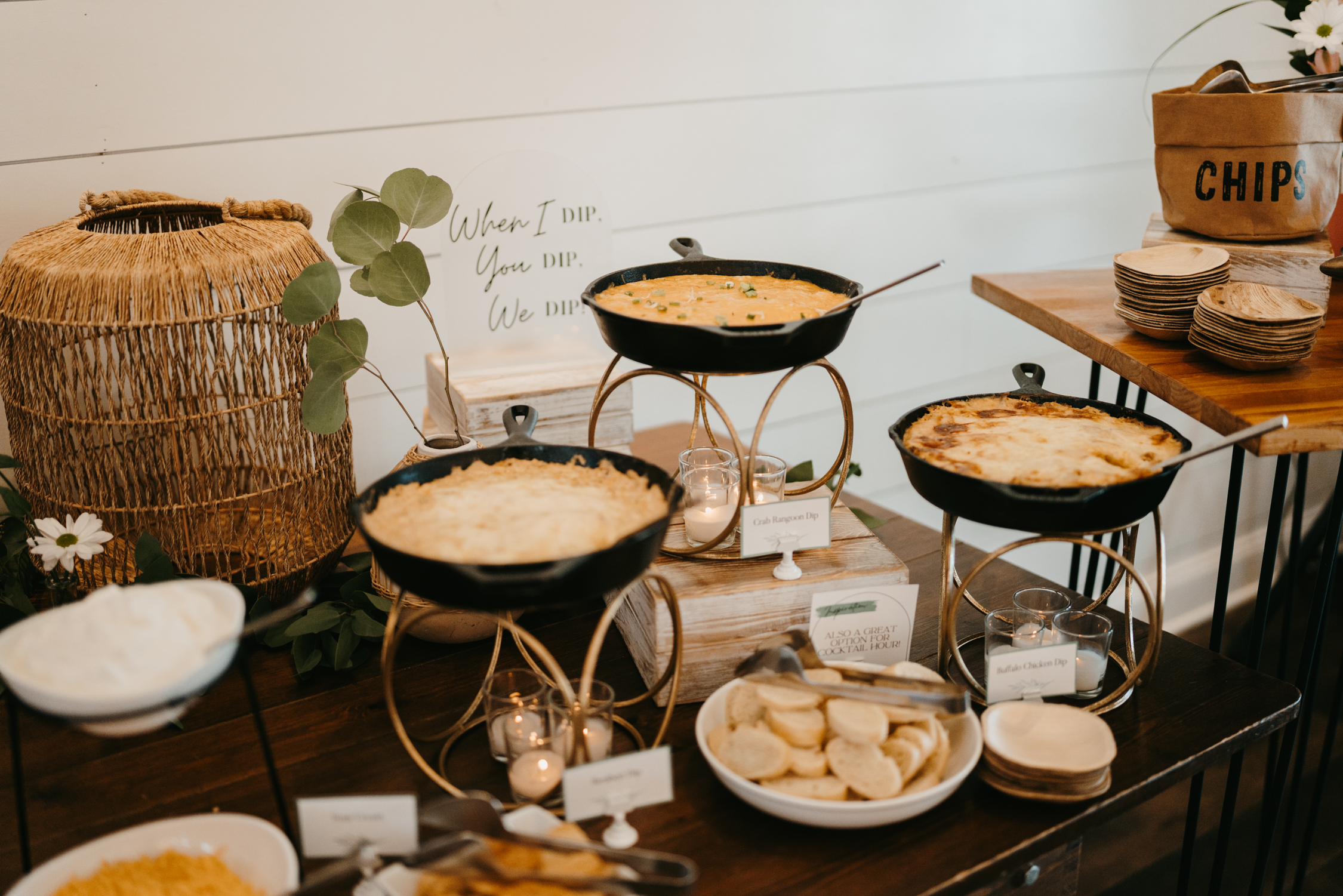 Dip Trio Station Appetizer Tablescape featuring a dip trio appetizer station with crab rangoon dip, reuben dip, loaded jalapeno cheddar dip and crostinis, accompanied by a fun acrylic sign reading 'When I dip, you dip, we dip,' perfect for weddings and events.