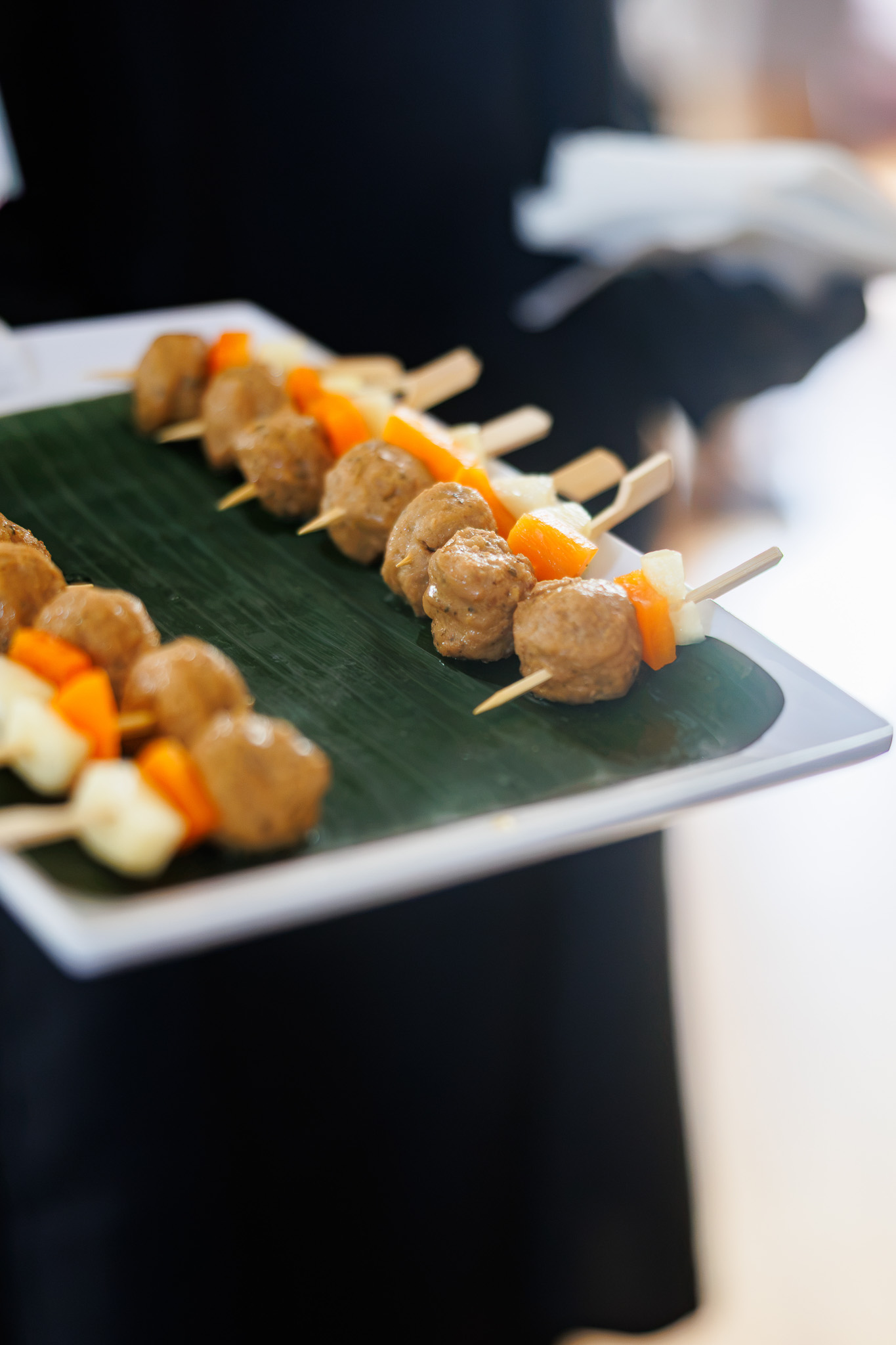 Passed Meatball Skewer Appetizer by Partyman Catering in Rochester NY Close-up of Partyman Catering's passed meatball skewer appetizer with fresh vegetables, served on a tray during cocktail hour at a Rochester, NY event.